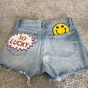 Blue Jean Shorts with Distressed Hem and High-Waisted Fit